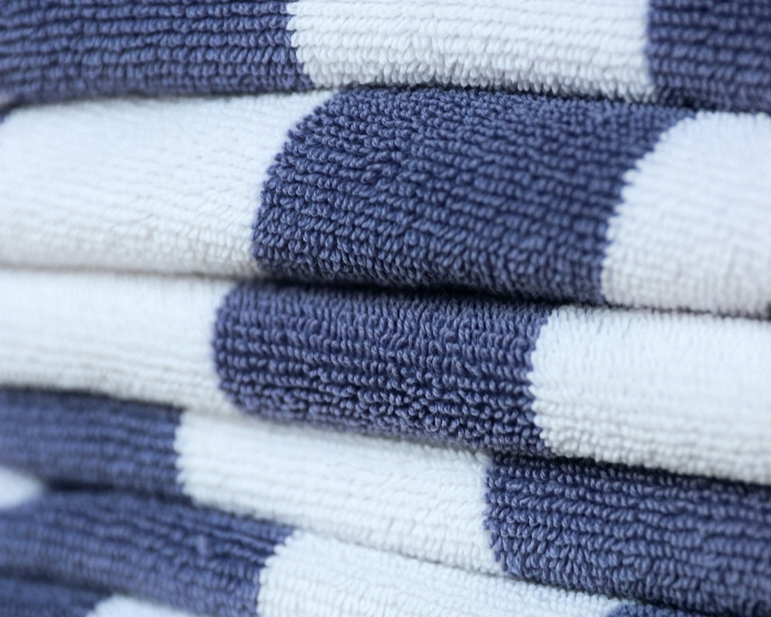 Stack of blue and white striped cotton towels