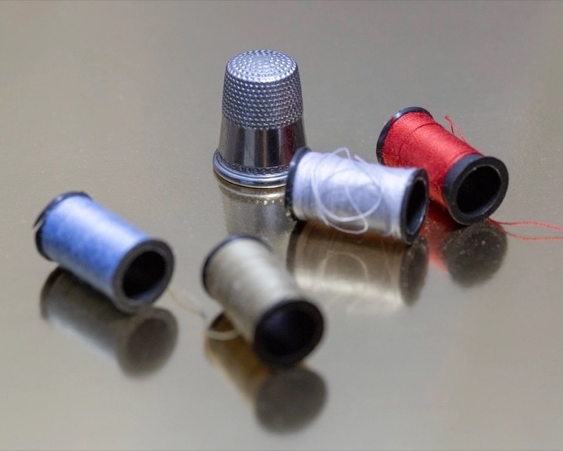 Thread spools and a metal thimble